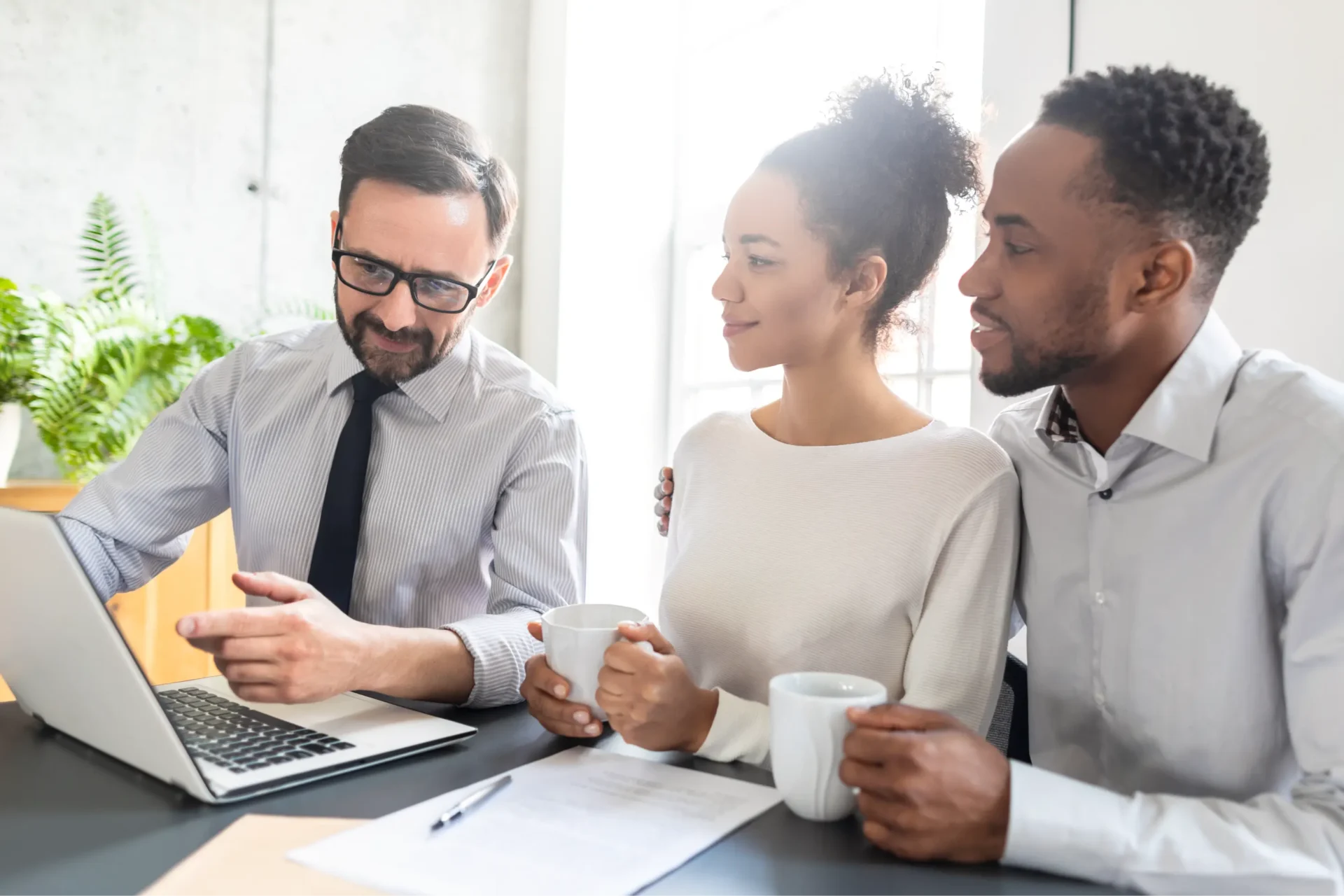 Couple discussing finances with advisor.