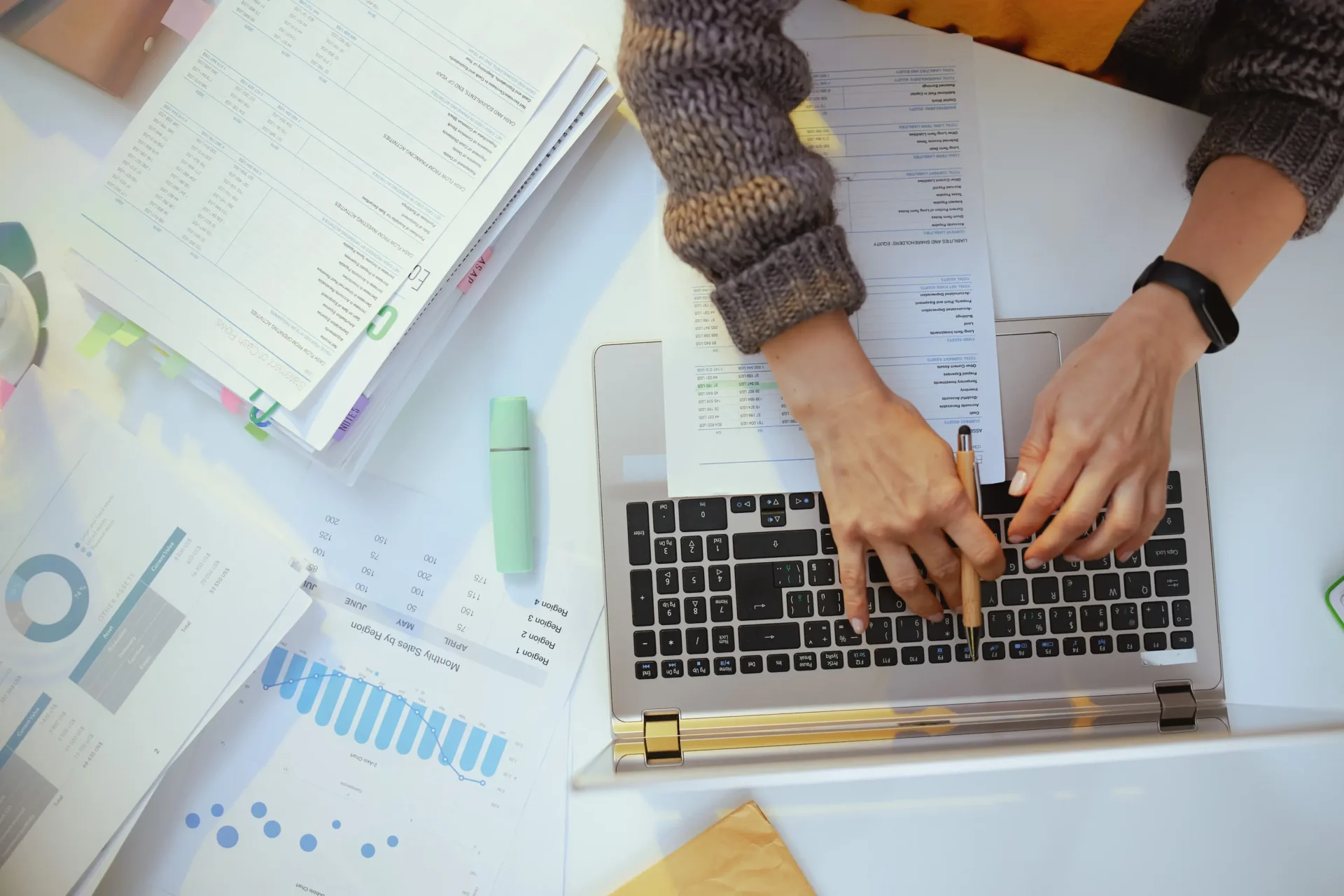 A person is typing on a laptop